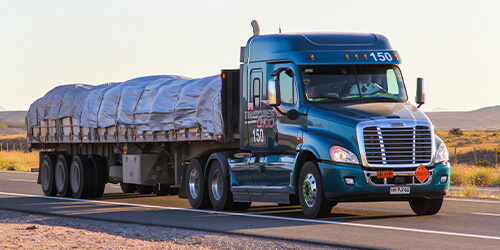 Truck with a Flatbed hauling Freight